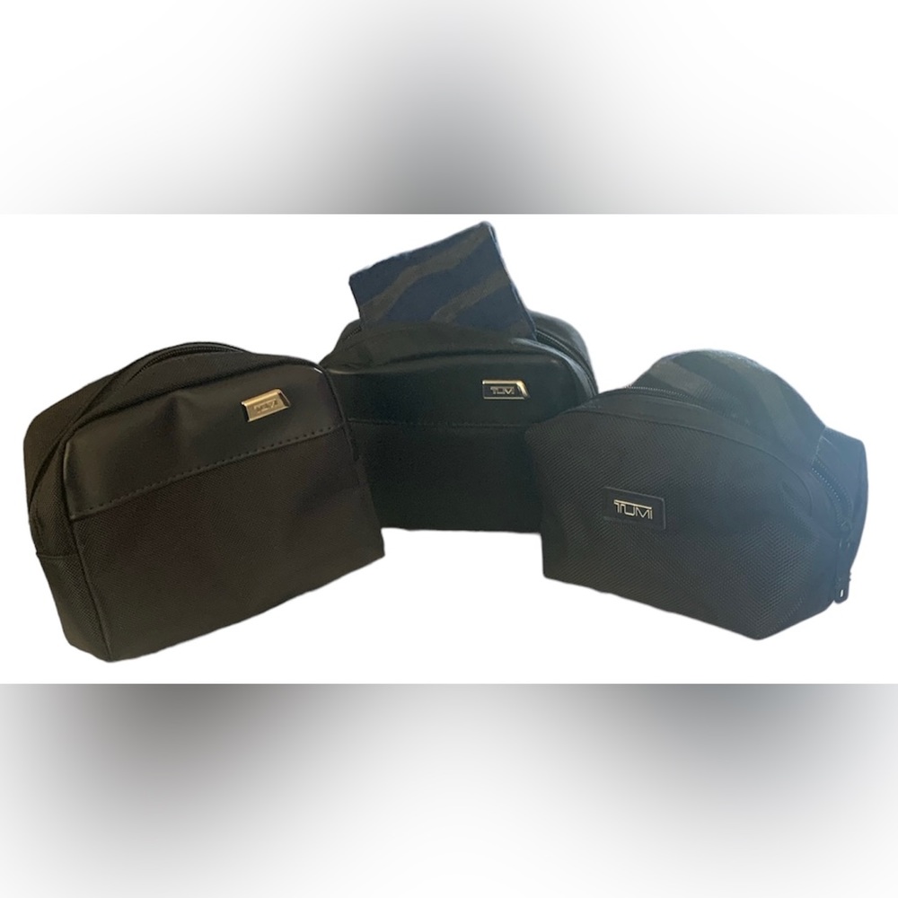 Tumi for Delta 3 Toiletry Bags. One bag is empty.